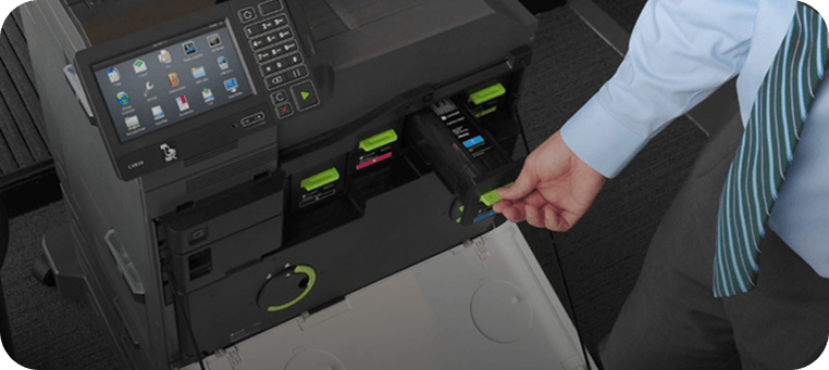 Person operating Lexmark printer with touchscreen