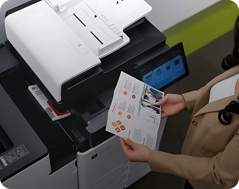 Person using Lexmark multifunction printer with documents